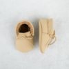 laced sand moccasins over